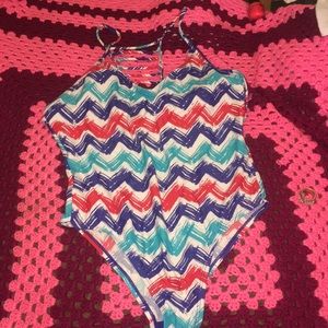 A Red,AquaBlue, Dark Blue , And White Bathing suit